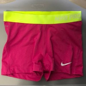 Pink and yellow Nike dry fit shorts